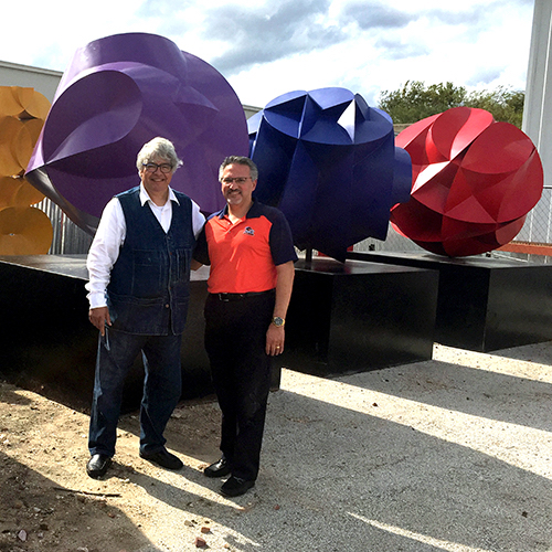 Maestro Sebastian with Almeida in front of one of Sebastian's many monumental sculptures that grace the historic plazas, colleges, and other buildings around San Antonio.