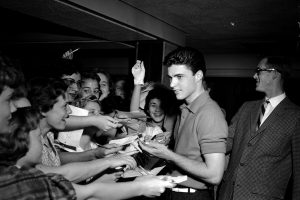 Ricky Nelson signing autographs