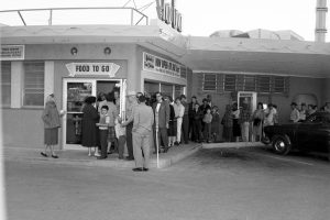 Customers standing in line outside of Earl Abel's Restaurant