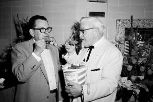 Earl Abel and Colonel Sanders eating Kentucky Fried Chicken at Earl Abel's Restaurant