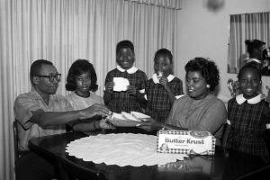 East Side family posed with Butter Krust bread ad