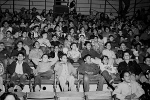 Schoolboys fill up the stands at the rodeo