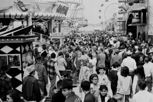A crowd of people enjoying the 1970 rodeo carnival