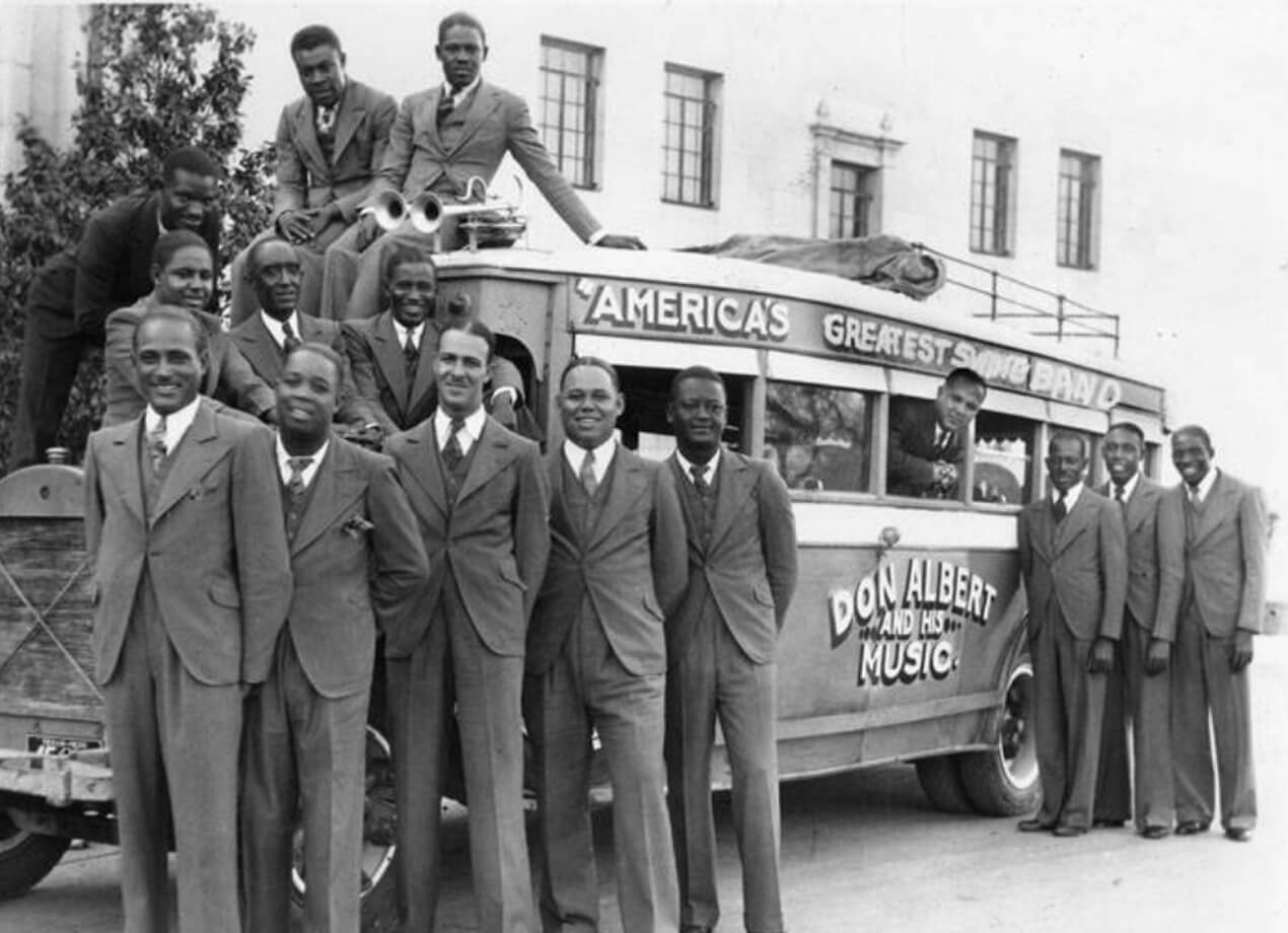Don Albert and members of his orchestra beside their bus on their sixth tour, Spring 1935