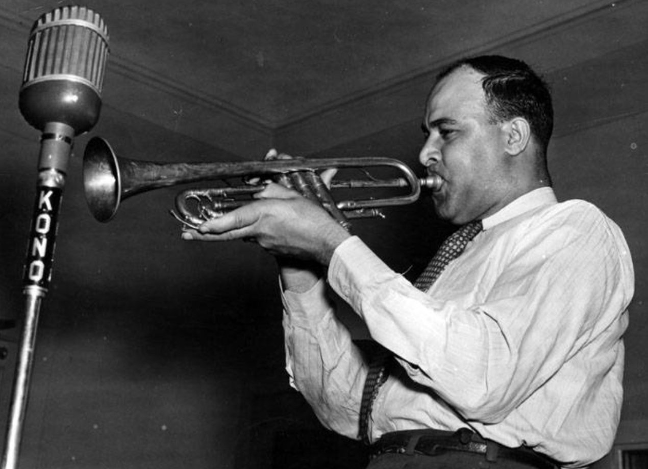 Don Albert playing his trumpet into KONO Radio microphone, San Antonio, Texas, 1950s